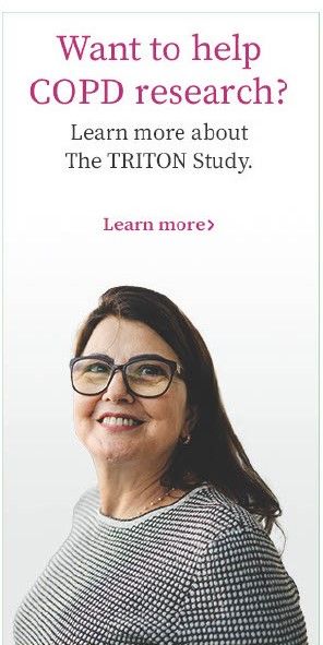 A woman with glasses is smiling for the triton study.